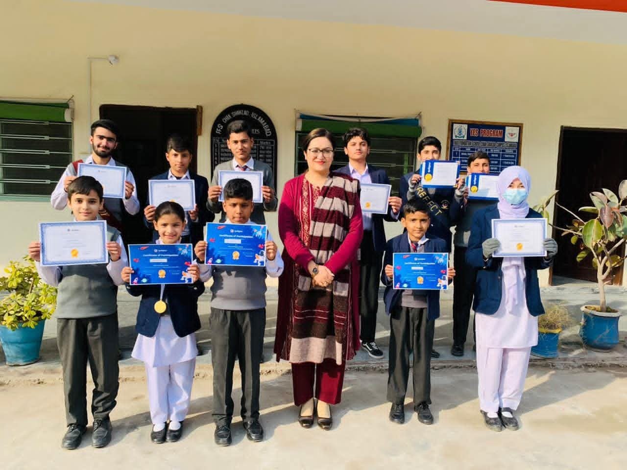 Students and teacher with certificates
